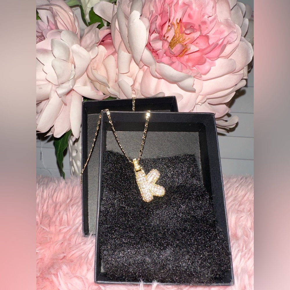 Brass-chin bubble initial K necklace.